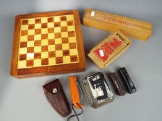 A mixed lot to include a chess set, box of additional Staunton chess pieces, boxed dominoes,