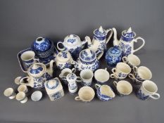 A quantity of blue and white ceramics comprising ginger jars, teapots, coffee pots and similar.