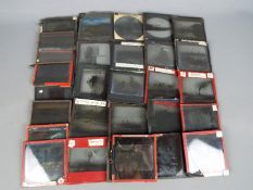 A collection of thirty six 3¼" sq magic lantern slides, varying images to include castles, boats,