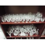Two shelves of various glassware to include Stuart Crystal and similar.