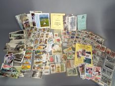 A large collection of cigarette cards and a collector's guide (1994)