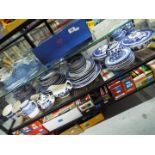 A quantity of blue and white tableware comprising, tureens, plates, side plates, cups, saucers,