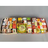 A large quantity of vintage matchboxes and matchbooks, three boxes in total.