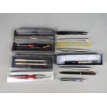 A collection of pens and propelling pencil to include Parker, a Mabie,