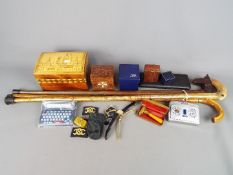 A mixed lot of collectables to include walking sticks, trinket box, vintage razor,