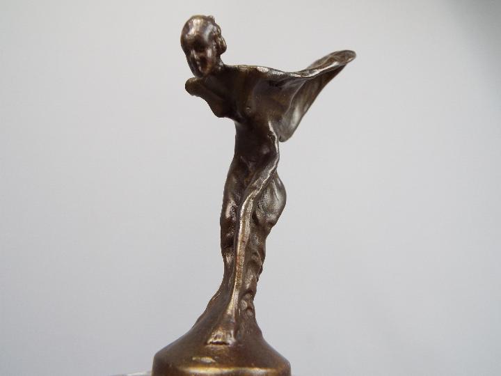 A bronzed flying lady in the form of Spirit of Ecstasy set on a marble plinth, - Image 3 of 3