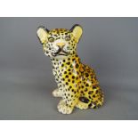 An Italian ceramic model depicting a leopard cub, impressed signature mark,