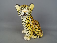 An Italian ceramic model depicting a leopard cub, impressed signature mark,