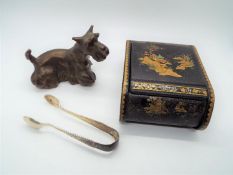 A bronze model depicting a Scottish terrier,