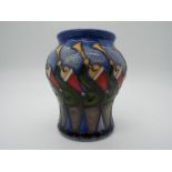 A Moorcroft vase decorated with 11 pipes, approx height 18.