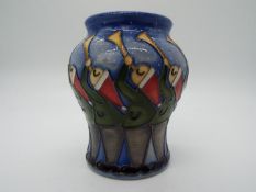 A Moorcroft vase decorated with 11 pipes, approx height 18.