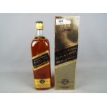 A boxed 1 litre bottle of Johnnie Walker Black Label, Extra Special 12 year old blended whisky.