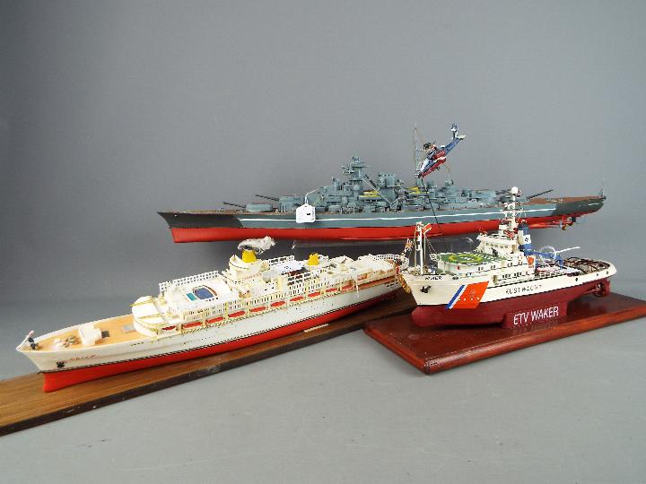 Three kit / scratch built model ships, the largest approximately 70 cm (l).