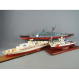 Three kit / scratch built model ships, the largest approximately 70 cm (l).