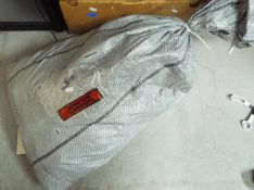 Costume Jewellery - A sealed sack containing approximately 24 Kg of unsorted costume jewellery.