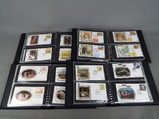 Philately - Four suede binders containing Benham silk first day covers including Science Fiction,