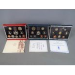 Three Royal Mint United Kingdom proof coin sets comprising 1990, 1996 and a 1997 Deluxe Proof Set,