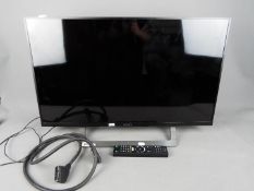 A Sony 32" flatscreen television, model KDL-32WD756, with remote.