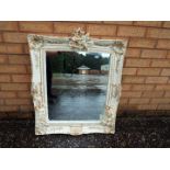 A pair of decorative wall mirrors, the frames with decoration of fairies,