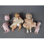 German Ceramic Dolls - a collection of four small bisque dolls ranging in size from 10 cm to 6.