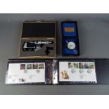 An album containing a collection of first day covers, boxed Mitutoyo measuring gauge and similar.