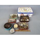 Clock Parts - a vintage tin containing three white metal pocket watches and a quantity of watch and
