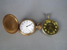 A gold plated Waltham full hunter pocket watch (glass and seconds hand missing) and a WWI 30 Hour