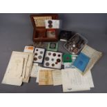 A collection of coins and banknotes to include silver content examples.