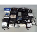 Photography - A collection of cameras to include a Canon EOS650, Fujifilm, Olympus, Sony,