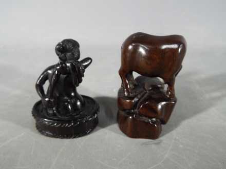 A vintage Japanese dark wood Netsuke depicting a lady bathing, - Image 2 of 2