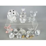 A collection of Swarovski style figures to include animals, fruit, eggs in egg cups and similar,