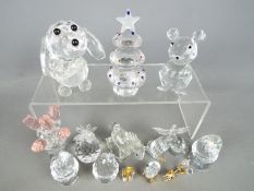 A collection of Swarovski style figures to include animals, fruit, eggs in egg cups and similar,