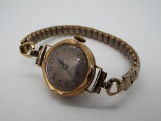 A lady's Victorian dress watch with expanding wrist strap, stamped 375 to the watch case.
