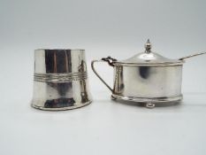 A silver plated mustard pot raised on four bun feet with spoon and a plated open salt,