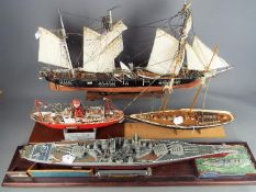 Four kit / scratch built model ships, the largest approximately 76 cm (l).