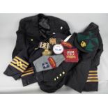 A collection of merchant navy jackets with insignia.