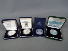 Four silver proof coins of Maltese issue, all encapsulated and contained in presentation cases.