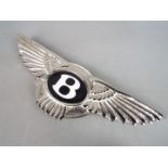 A chrome Bentley wall plaque,