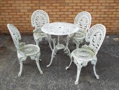 A vintage painted metal garden table and four chairs, table approximately 70 cm (h) and 68 cm (d).