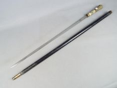 An early 20th century swordstick with bone and horn handle, ebonised cover with brass ferrule,