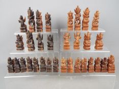 Chess Set - A carved wood chess set, king approximately 10.