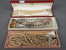 A mixed lot of costume jewellery to include five sets of various pearl necklaces,