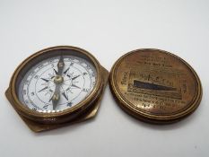 A brass compass