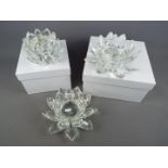 Three glass centrepieces by Julian MacDonald in the form of flower heads, two boxed.