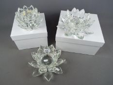 Three glass centrepieces by Julian MacDonald in the form of flower heads, two boxed.