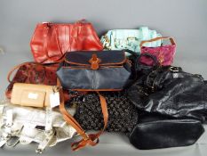 A collection of lady's handbags and purses.