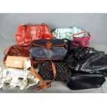 A collection of lady's handbags and purses.