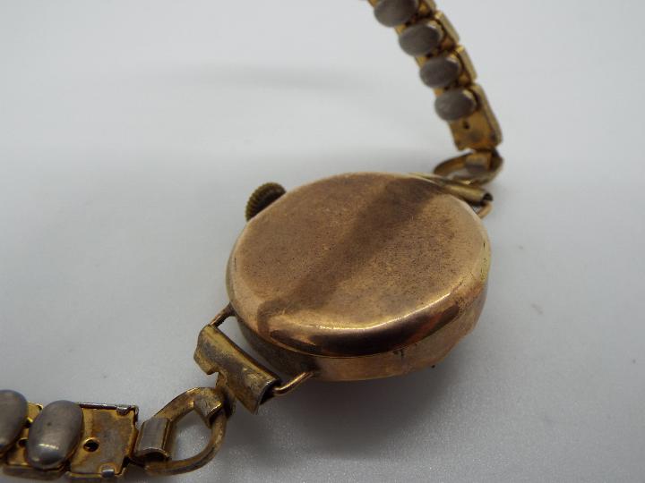 A lady's Victorian dress watch with expanding wrist strap, stamped 375 to the watch case. - Image 2 of 3