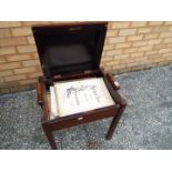 An Art Deco mahogany music stool,