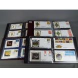 Philately - Four binders containing first day covers including numerous Benham silk covers